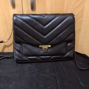 A Née Day black faux leather crossbody bag